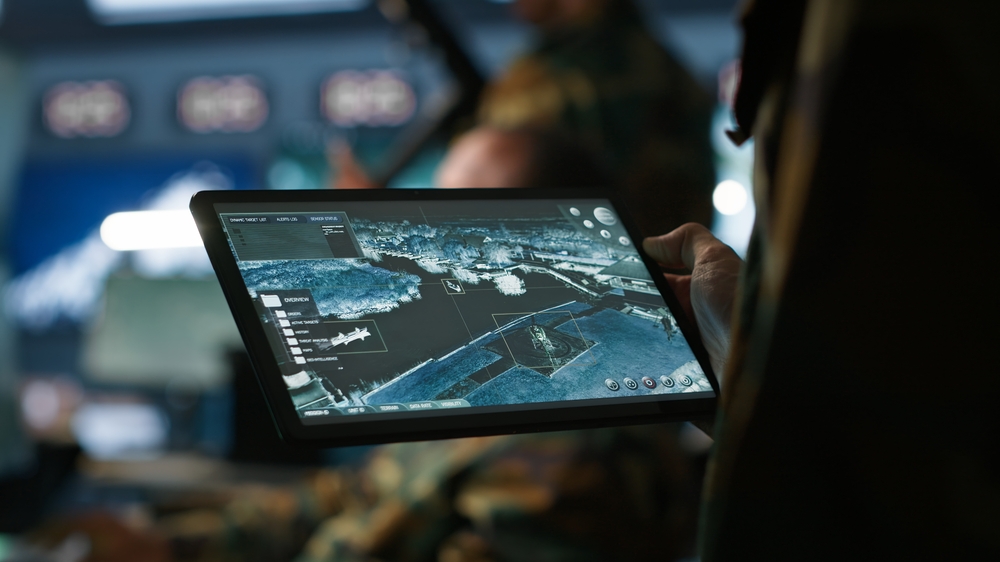 Military,Agent,Working,In,Control,Room,,Using,Software,On,Tablet,